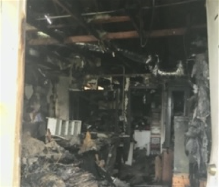 Severely fire damaged room.